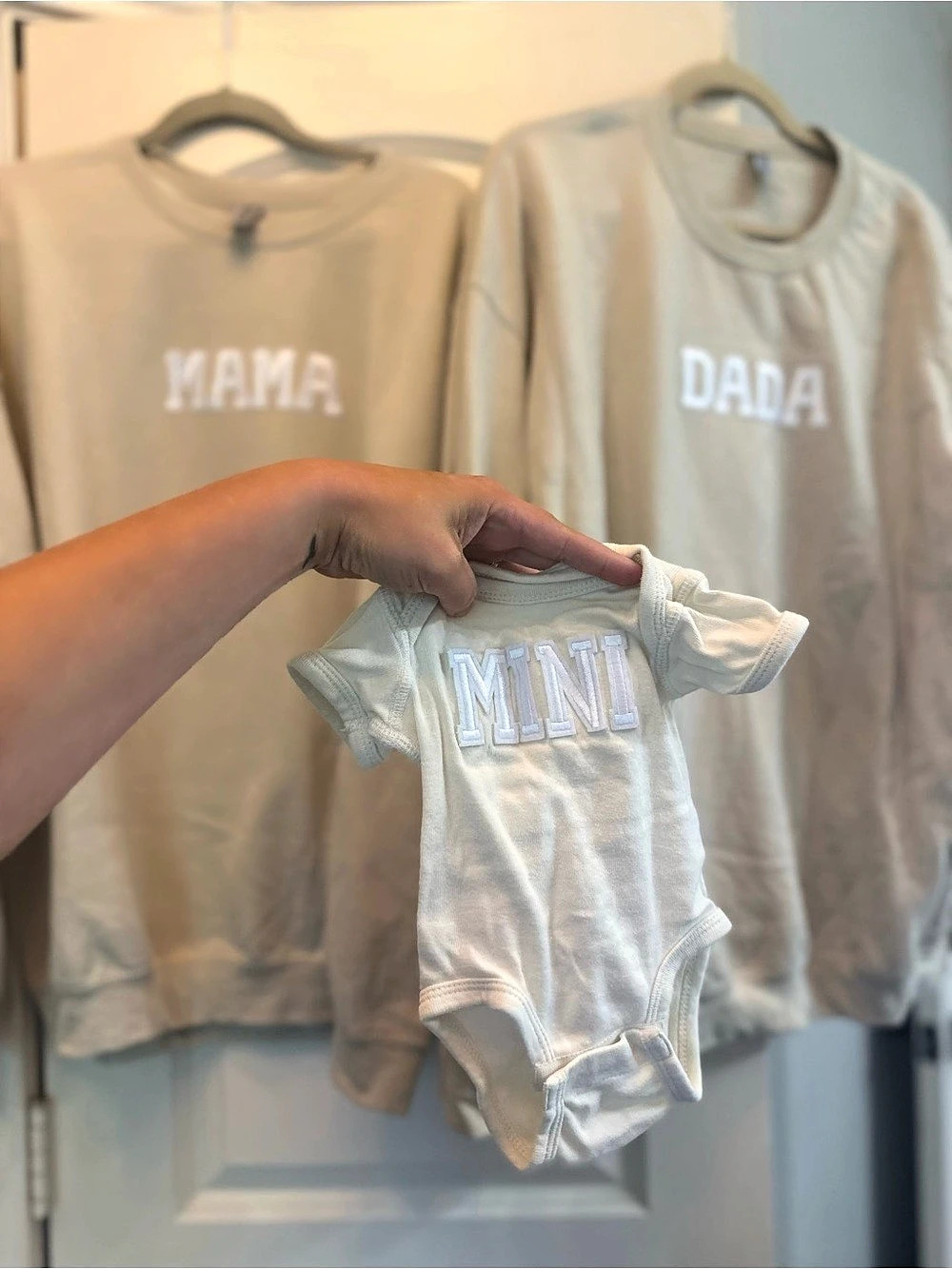 Mom, Dad, and Newborn matching outfits